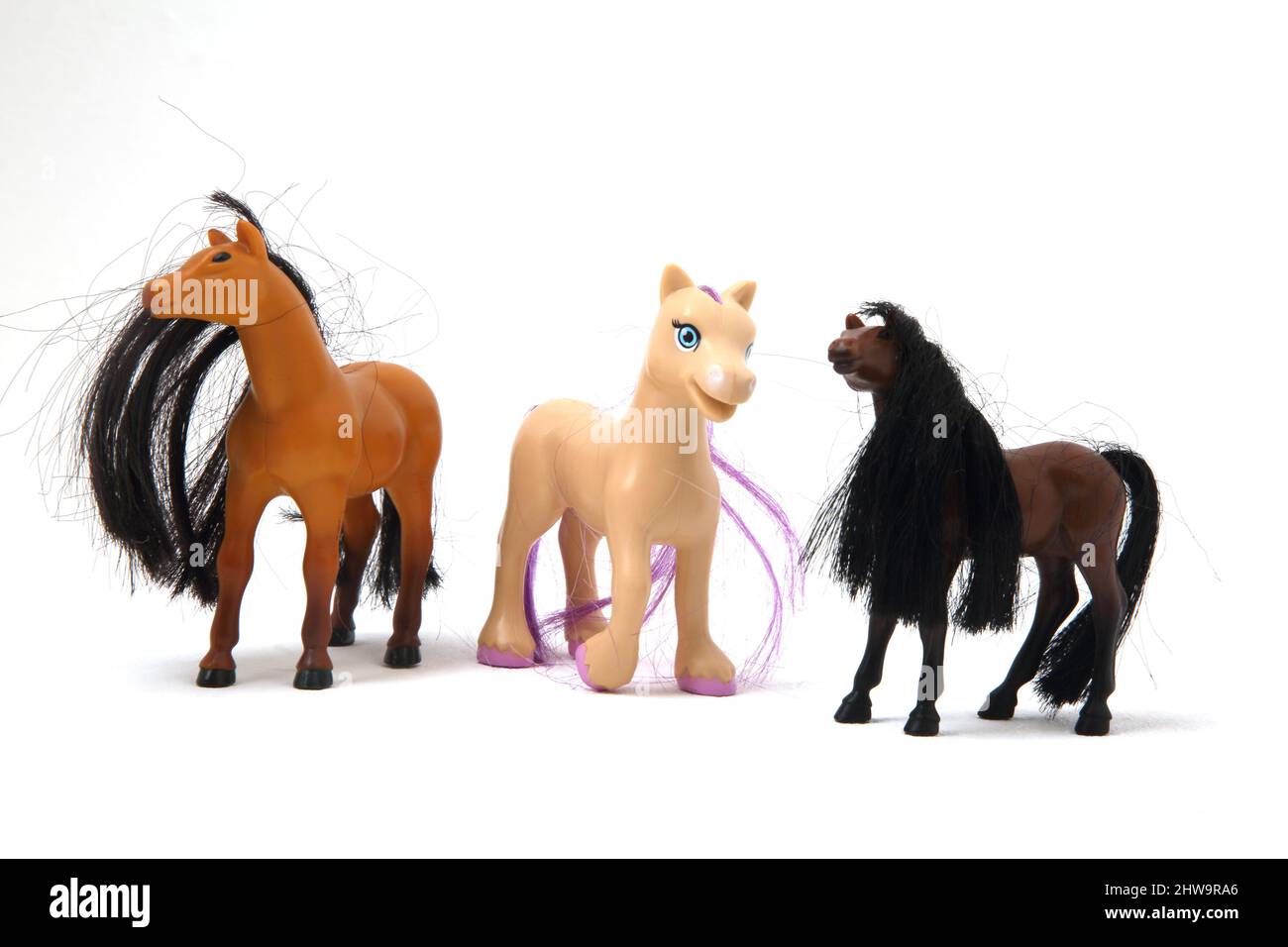 Drei Spielzeugpferde Stockfoto