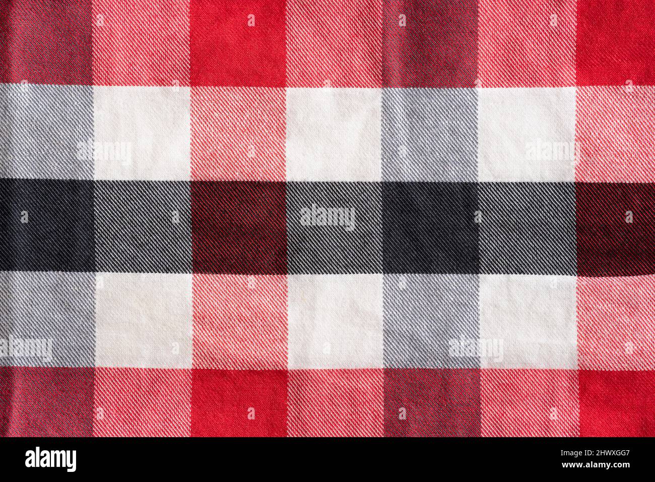Rot schwarz und weiß Schachmuster textiler Hintergrund Stockfoto