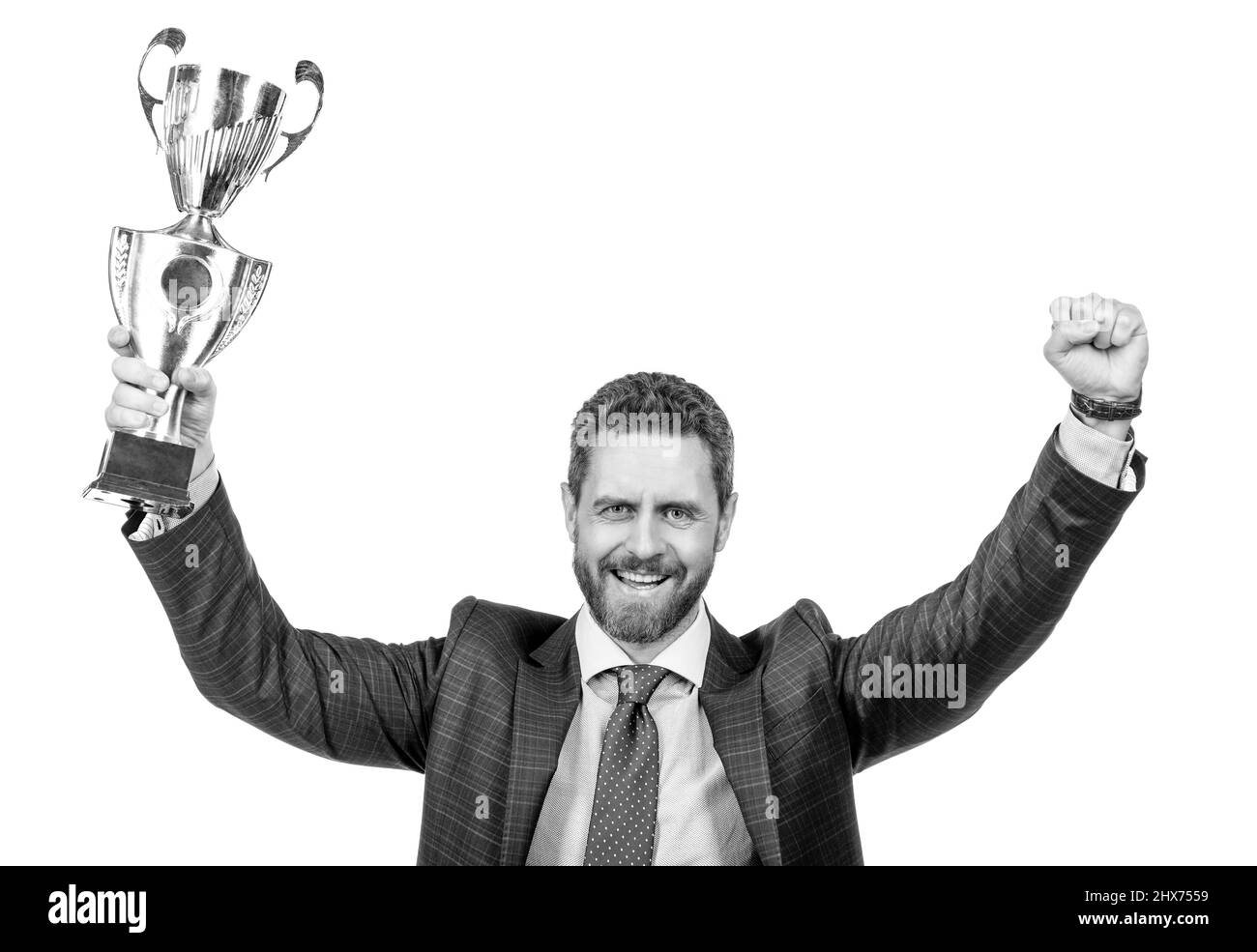 Erfolgreicher Geschäftsmann Mann in Anzug halten Champion Cup s geschäftliche Belohnung isoliert auf weiß, Sieg Stockfoto
