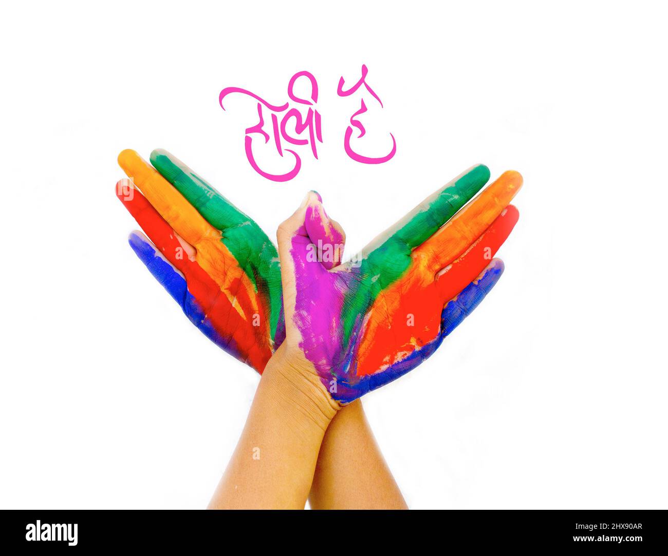 Holi Gruß in Hindi - Painted Hands Stockfoto