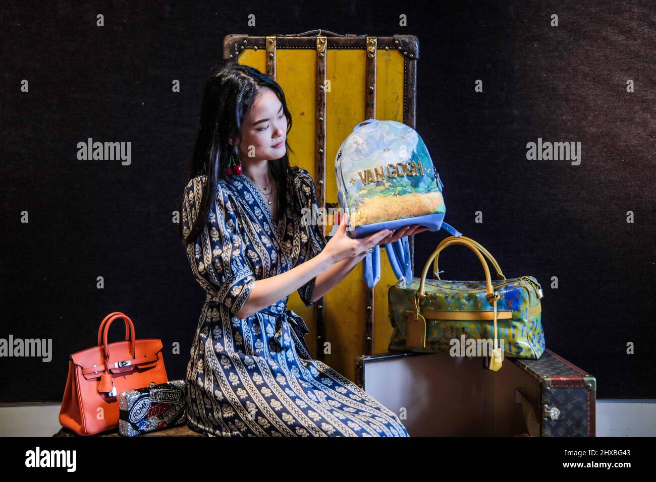 LONDON, UK. 11 March, 2022 . A staff member holds Louis Vuitton x Jeff  Koons: a Van Gogh 'Palm Springs' Backpack, Limited Edition Masters  Collection, 207. Estimate: £1,500 – 2,000 which will