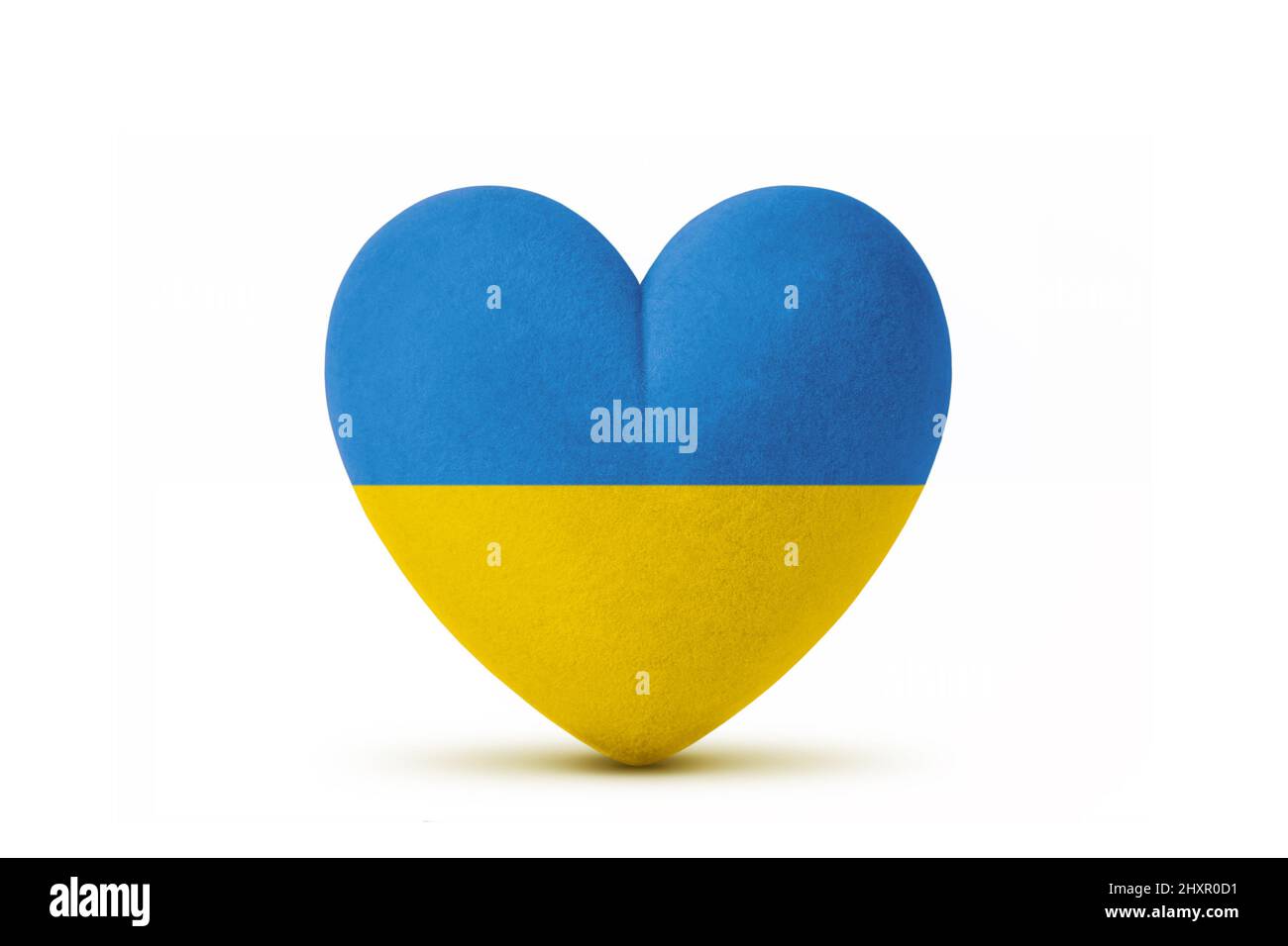 Herz mit ukrainischer Flagge - Konzept von Krieg stoppen und für die Ukraine beten Stockfoto