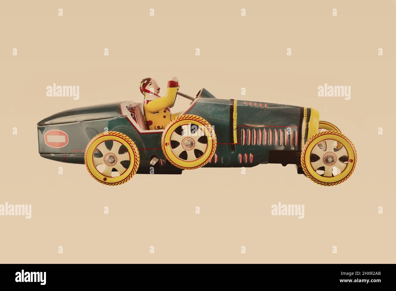 Retro-Stil Bild eines Vintage-Metall-Spielzeug Rennwagen mit Fahrer Stockfoto