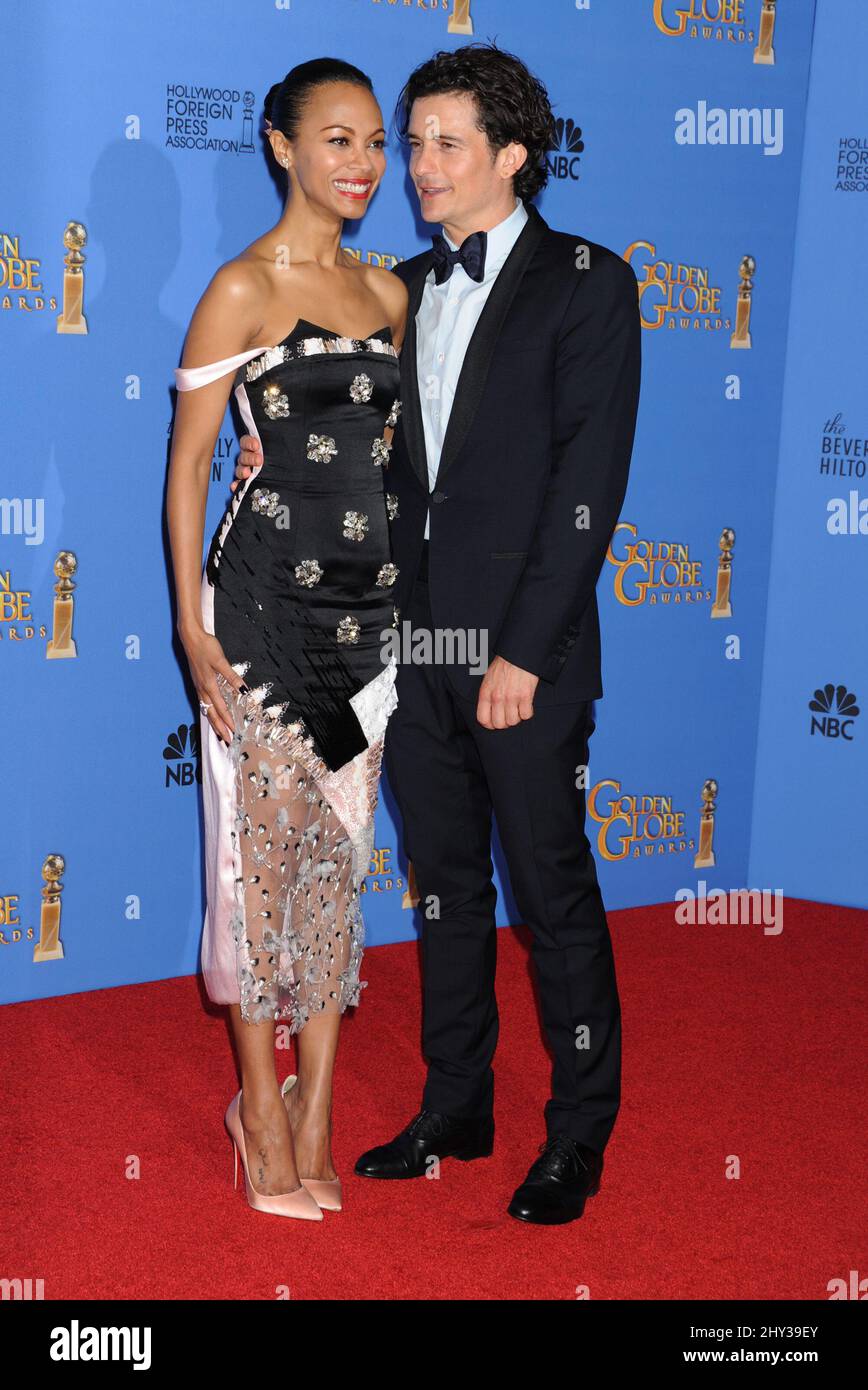 Zoe Saldana und Orlando blühen im Presseraum der Annual Golden Globe Awards 71., die am 12. Januar 2014 im Beverly Hilton Hotel stattfinden. Stockfoto