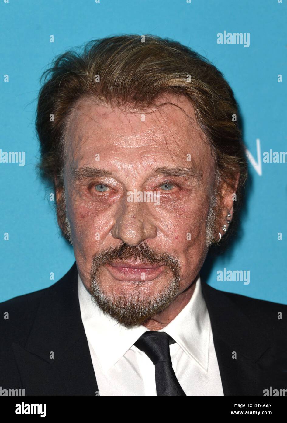 Johnny Hallyday nimmt an den Costume Designers Guild Awards 17. Teil, die im Beverly Hilton Hotel in Los Angeles, Kalifornien, abgehalten werden. Stockfoto