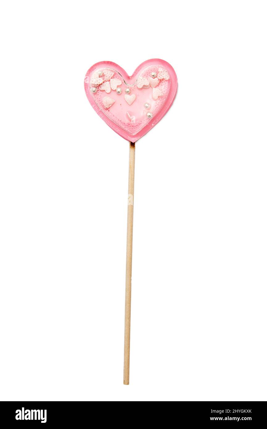 Rosa Stern lollipop innen auf einem Stock isoliert auf weiß. Geschenk zum Valentinstag. Quadratisches Format Stockfoto