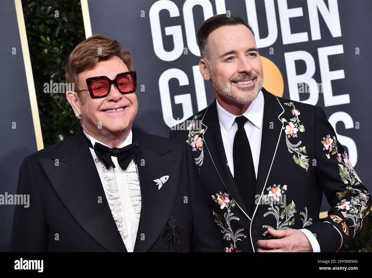 Elton John und David sind bei den Golden Globe Awards 77. im Beverly Hilton Hotel eingerichtet Stockfoto