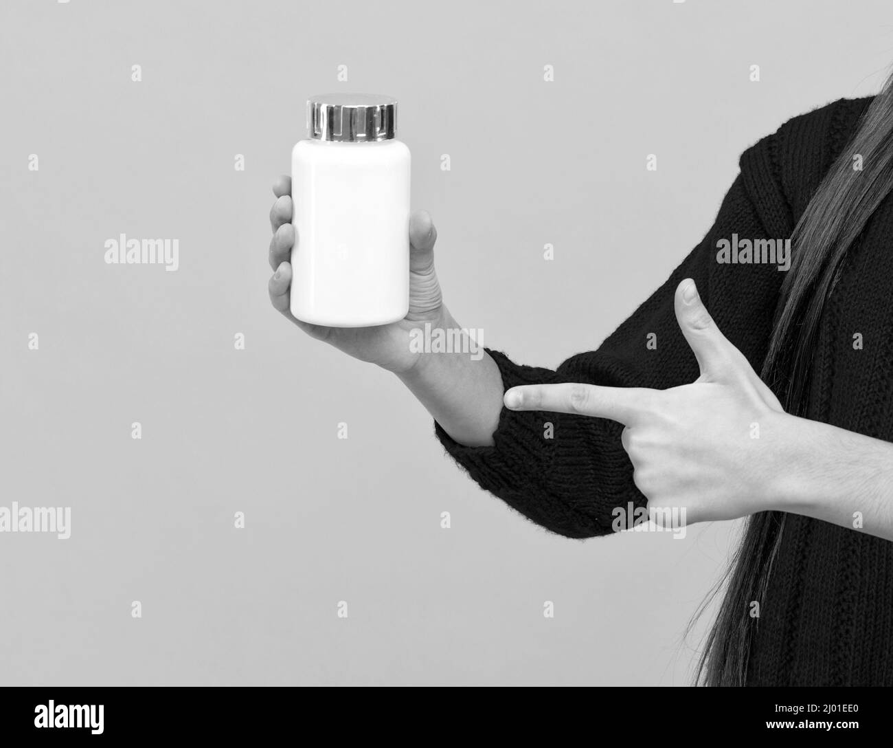 Hand zeigen Finger auf Pille Glas mit Kopierer Platz, Apotheken Stockfoto