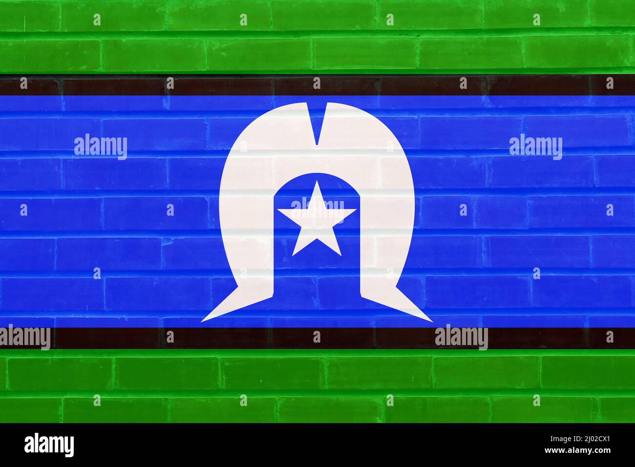 Die Flagge des australischen Torres Strait Islanders malte auf einer Ziegelwand Stockfoto