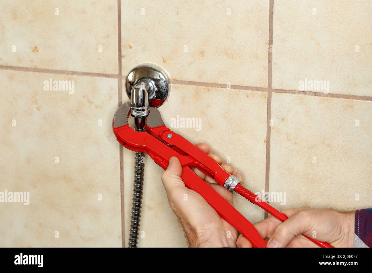 Arbeitshand am Greifer Stockfoto