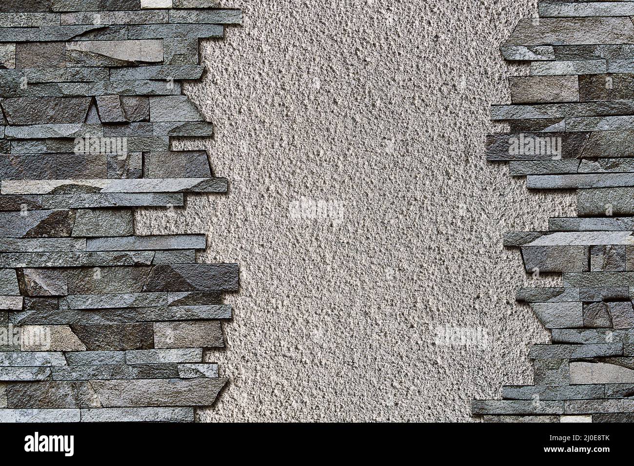 Grauer abstrakter Hintergrund mit einer Steinmauer Stockfoto