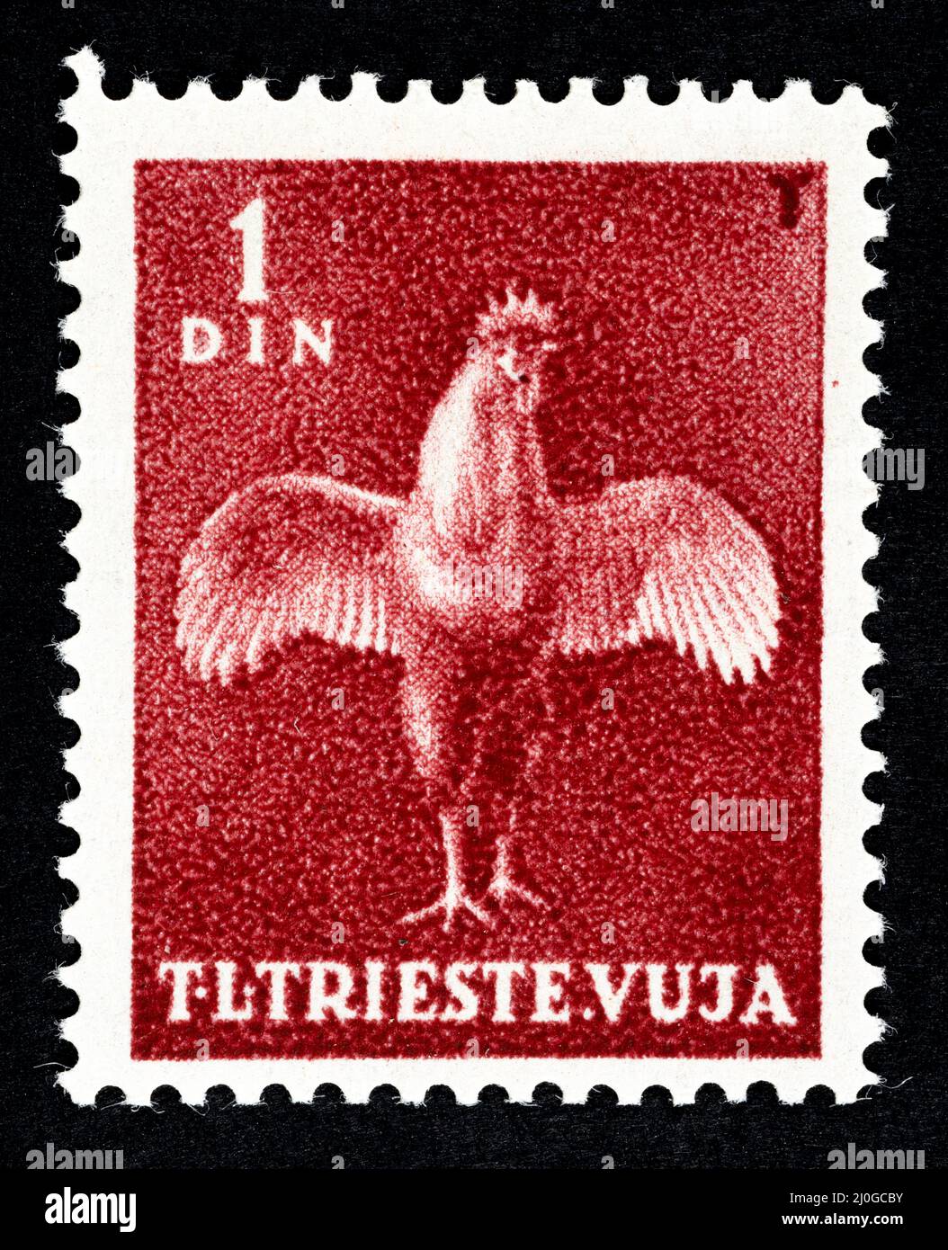 Gedenkmarke aus dem ehemaligen Jugoslawien, überdruckt STT VUJNA, mit Darstellung des Hahns des freien Territoriums von Triest, Zone Stockfoto