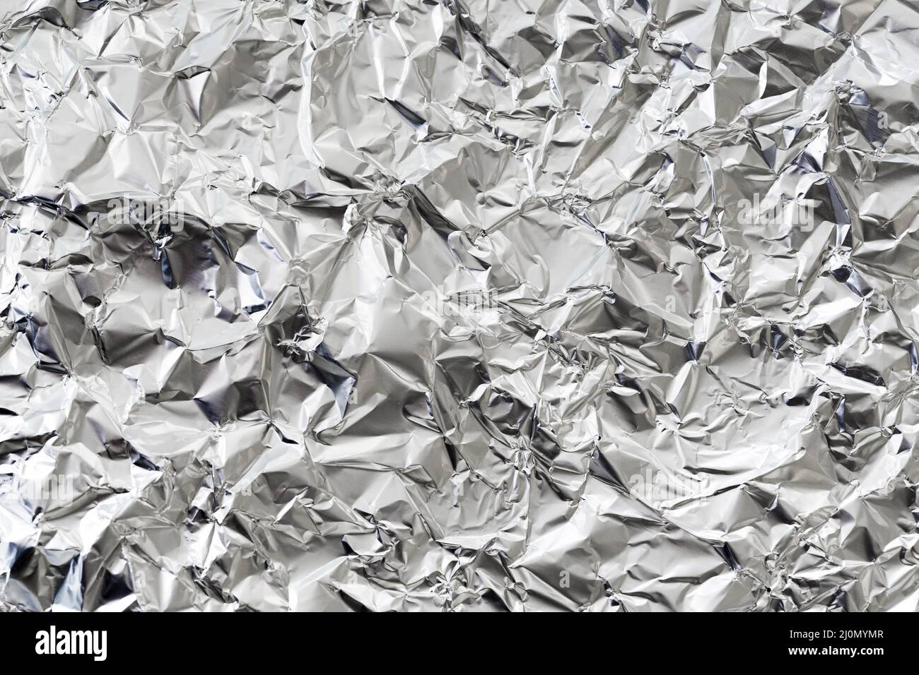 Zerknitterte silberne Aluminiumfolie Hintergrund Stockfoto