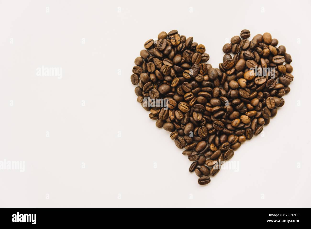 Kaffeebohnen Herzform Stockfoto