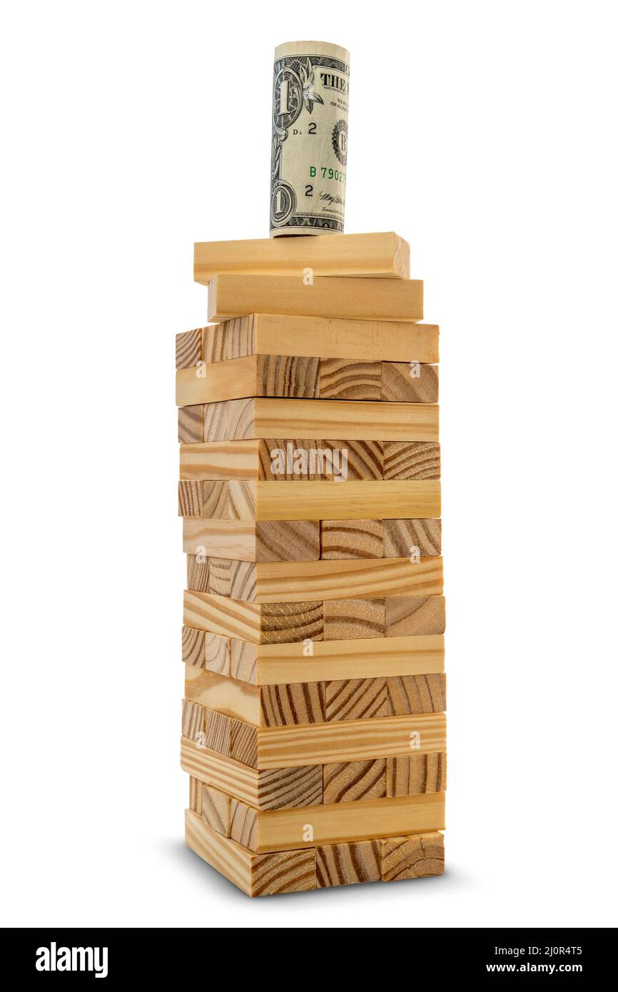 Dollar auf der Spitze eines Turms aus Holzblöcken Stockfoto
