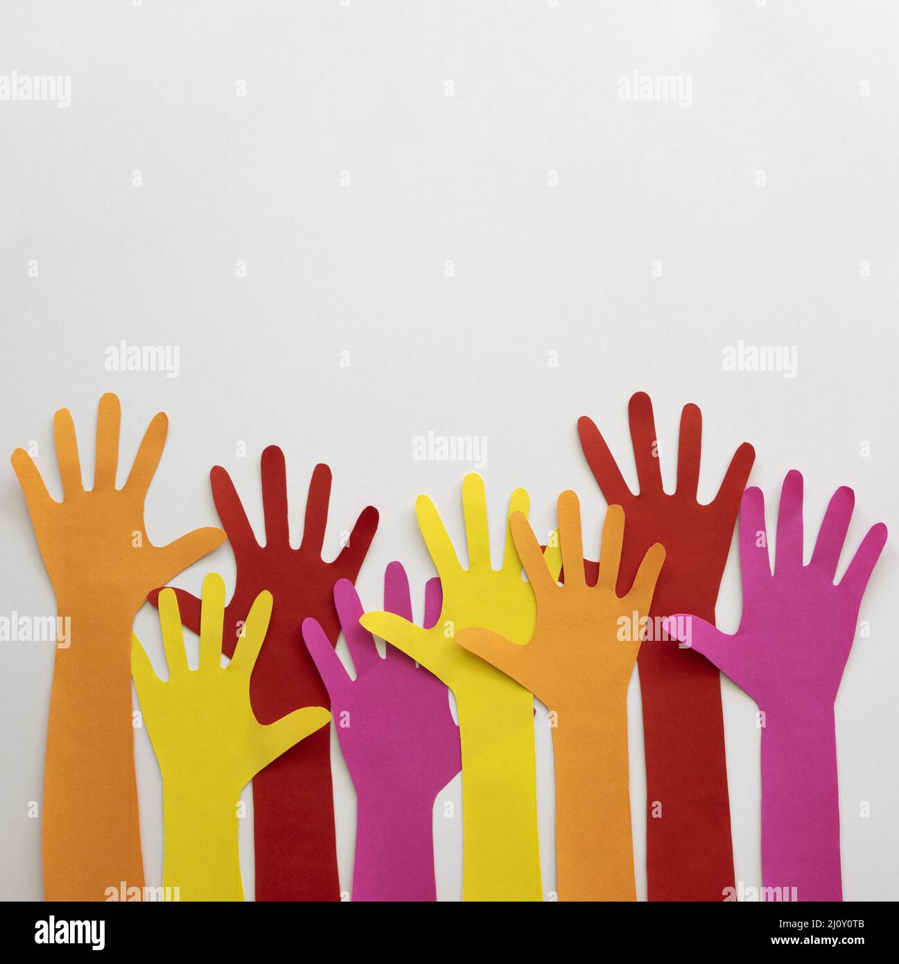 Bunte Origami Hände Form. Hochwertige Fotos Stockfoto