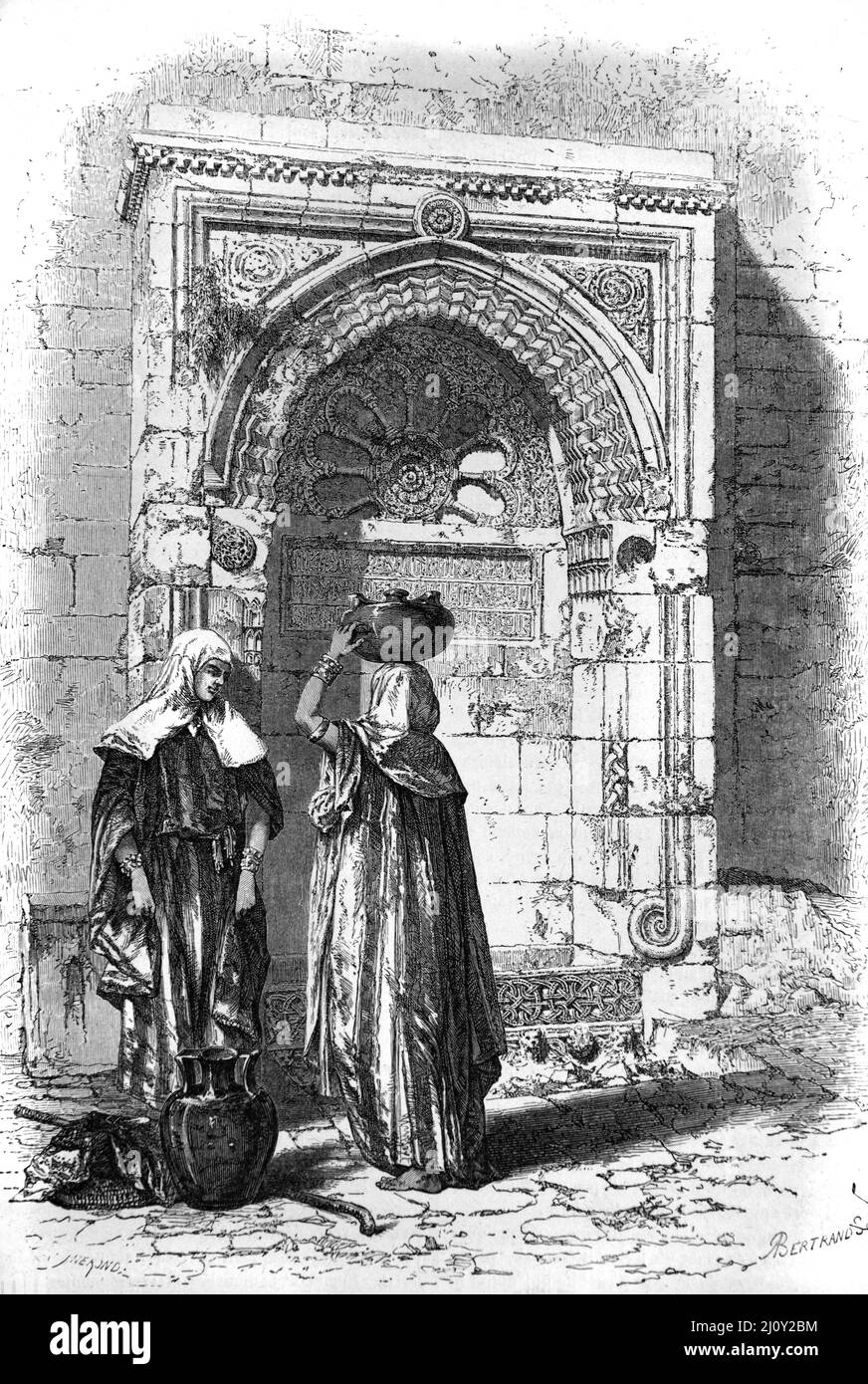 Frauen in Bethlehem sammeln Wasser und plaudern in der Straße vor dem Straßenbrunnen Bethlehem Palästina. Vintage Illustration oder Gravur 1860. Stockfoto