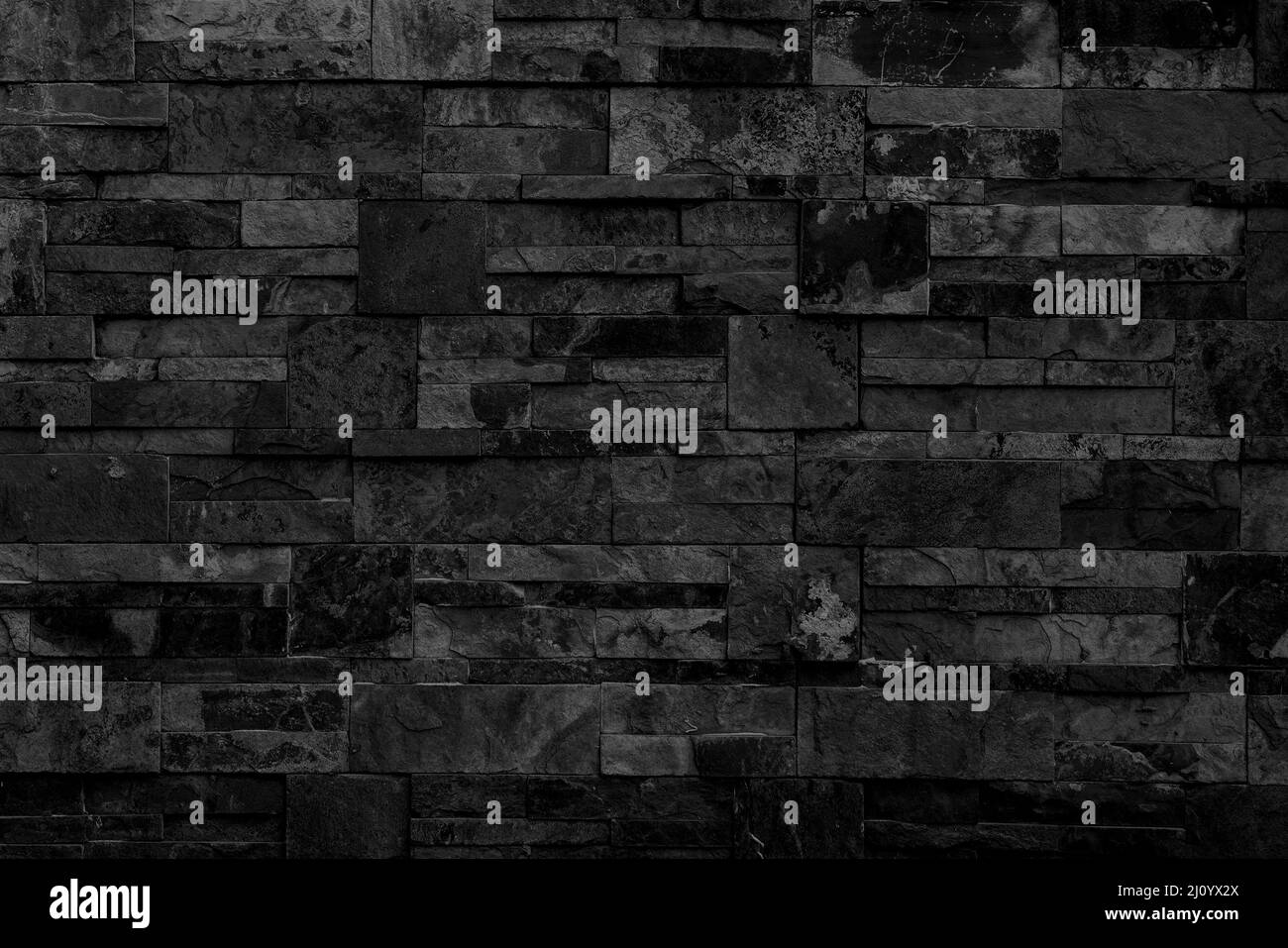 Schwarze Backsteinmauer. Interieur eines modernen Loft. Hintergrund für Design und Interviewaufnahme. Stockfoto