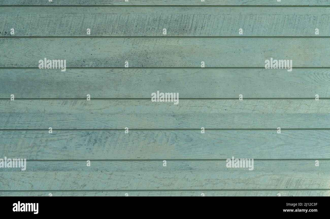 Den Rahmen mit Vintage-Holzwand, grüne Farbe mit wenig Schatten von Blau, Innenwand mit natürlichem Licht. Stockfoto