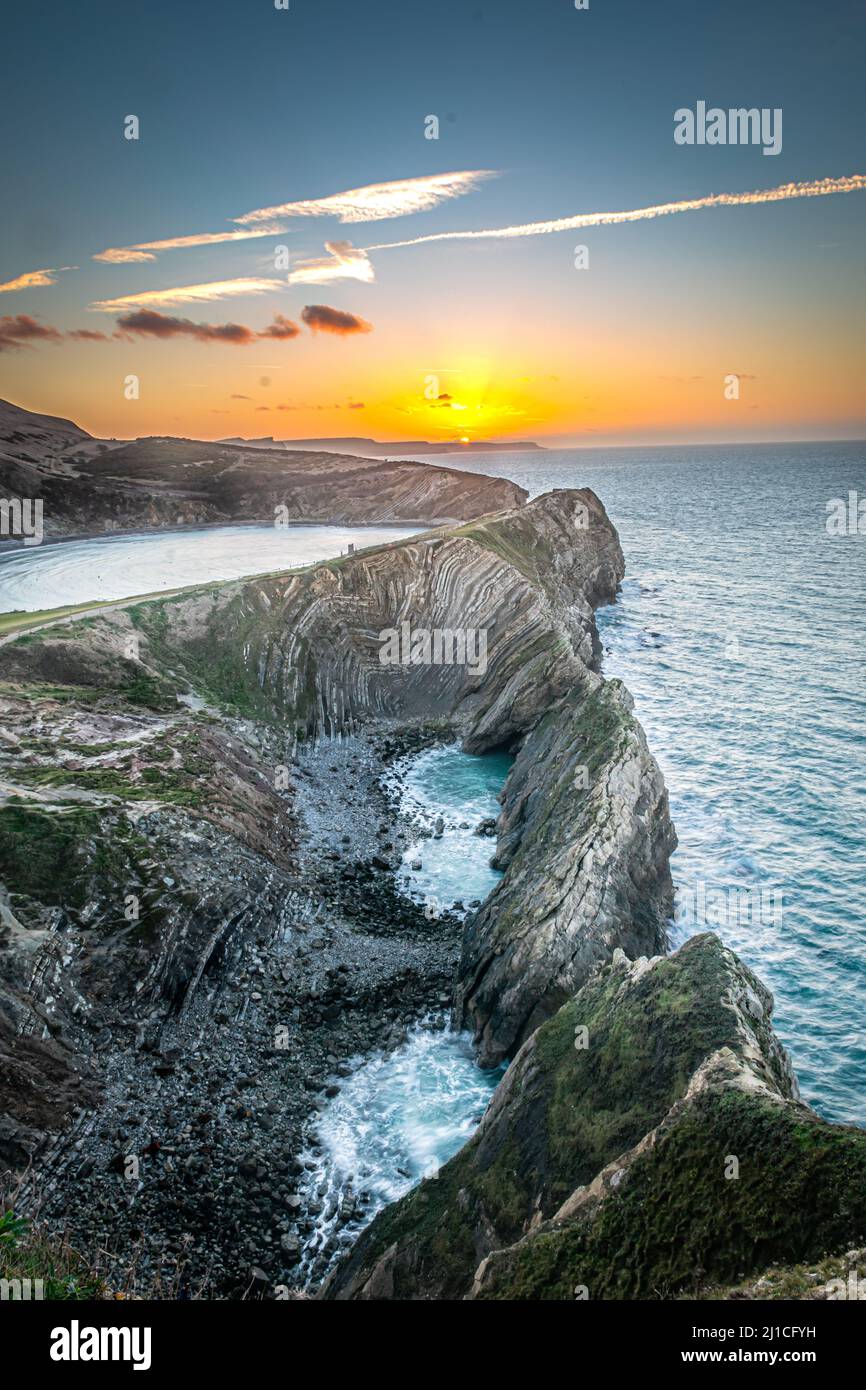 Lulworth Cove und Stair Hole bei Sonnenaufgang in Dorset, Jurassic Coast, England, Großbritannien Stockfoto