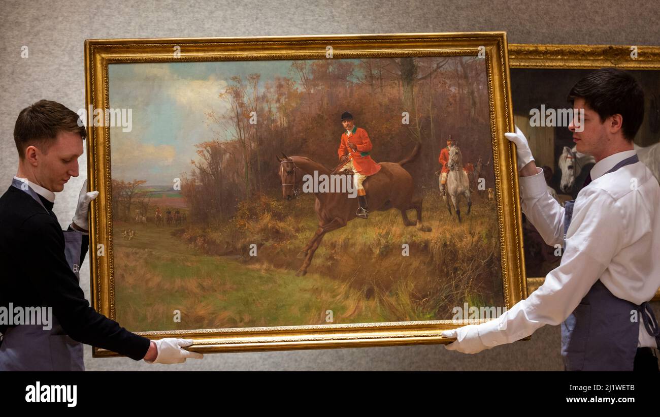 London, Großbritannien. 28. März 2022. Techniker präsentieren „The Fox Hunt“ von Thomas Blink (Est. £15.000 - £20.000) bei einer Vorschau auf Bonhams’ 19.. Jahrhundert und den Verkauf britischer impressionistischer Kunst, der am 30. März in den Galerien in der New Bond Street in Bonhams stattfinden wird. Kredit: Stephen Chung / Alamy Live Nachrichten Stockfoto
