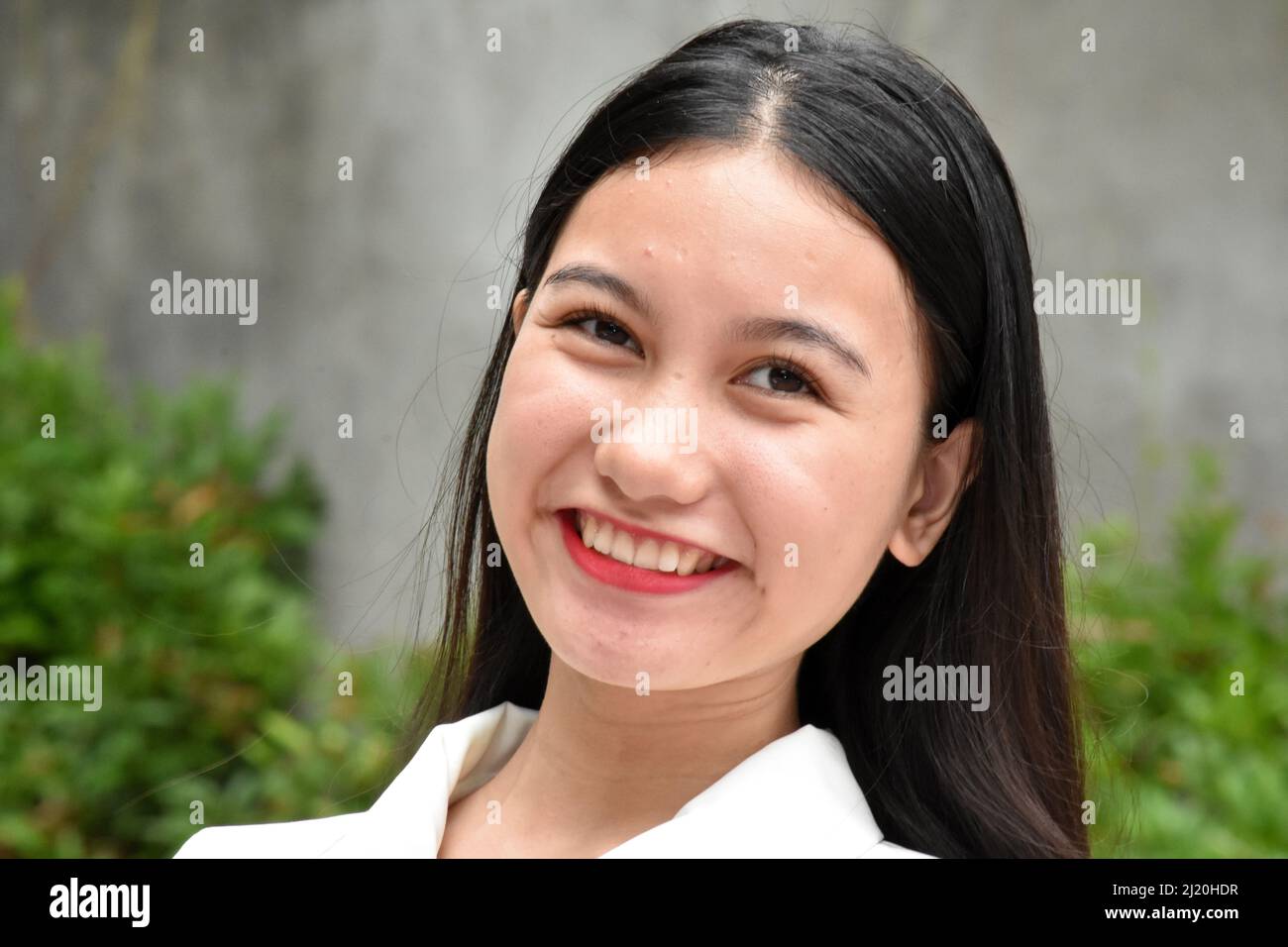 Eine lächelnde asiatische Frau Closeup Stockfoto