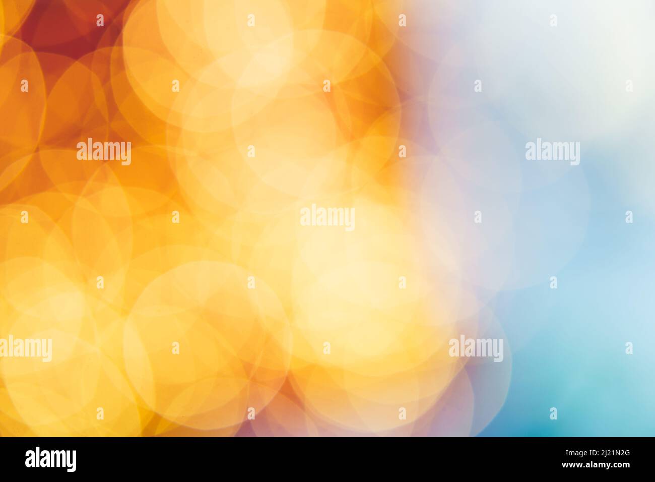 Abstrakter, gelber und blauer Bokeh-Hintergrund Stockfoto
