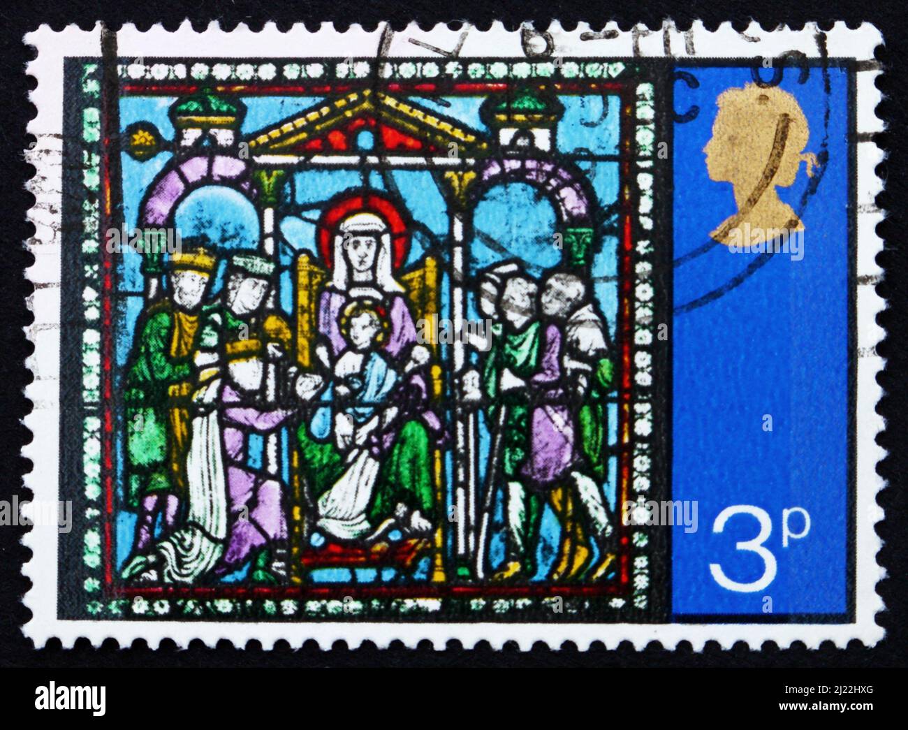 GROSSBRITANNIEN - UM 1971: Eine in Großbritannien gedruckte Marke zeigt die Anbetung der Könige, aus Buntglasfenstern, Canterbury Cathedral, um Stockfoto