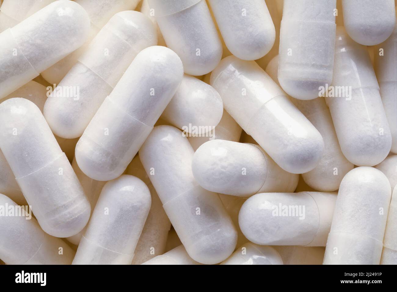 Stapel von verschreibungspflichtigen Medizin Capsule Pills Hintergrund Nahaufnahme. Stockfoto