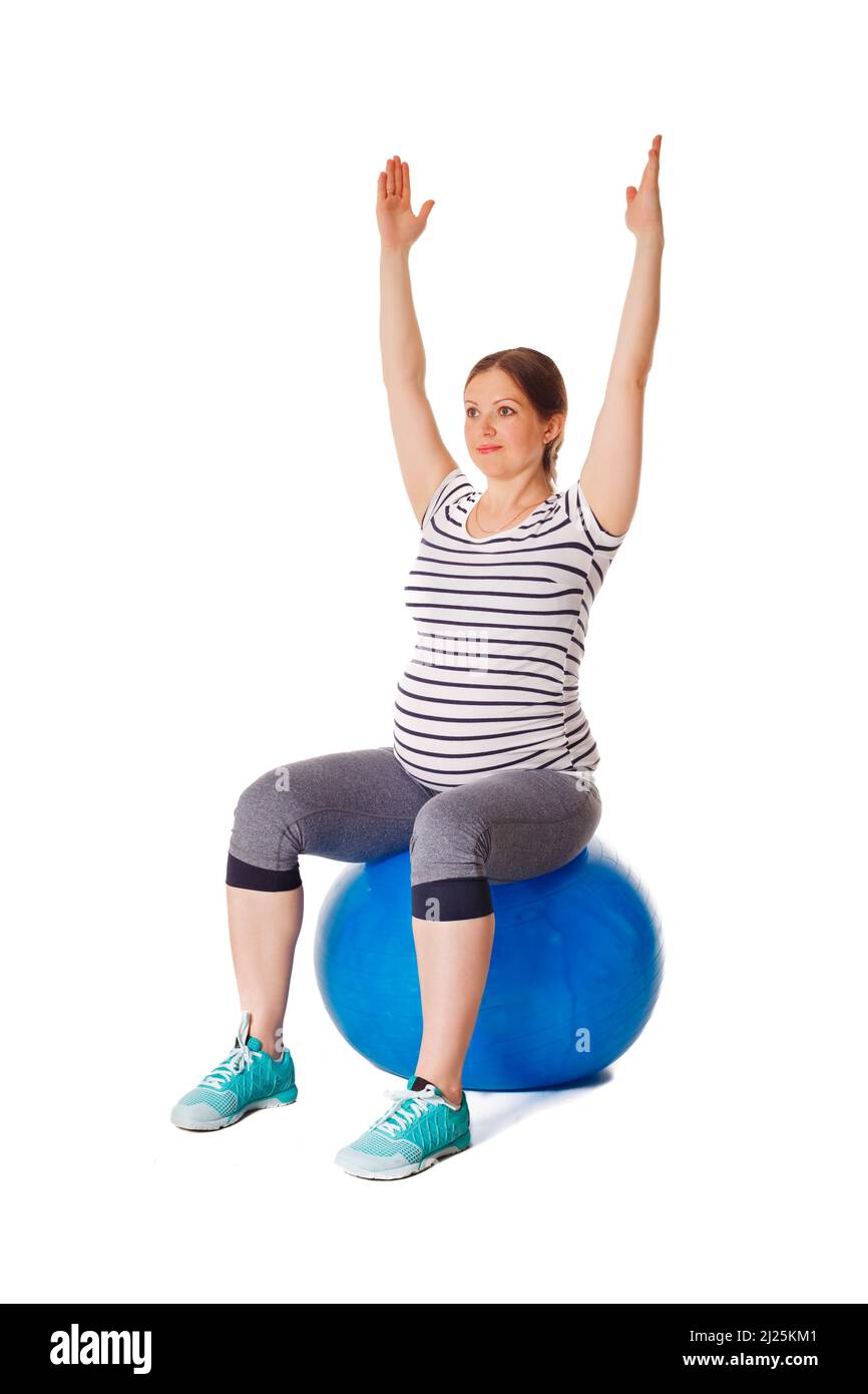 Schwanger Frau macht Übungen mit Gymnastikball Stockfoto