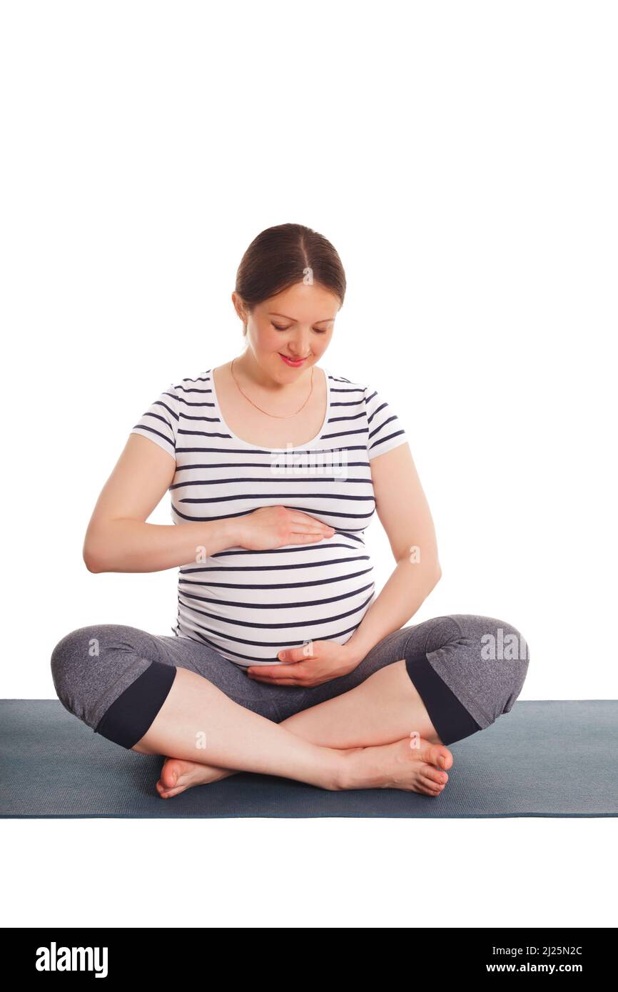 Schwangere, die Yoga Asana Asana Sukhasana macht Stockfoto