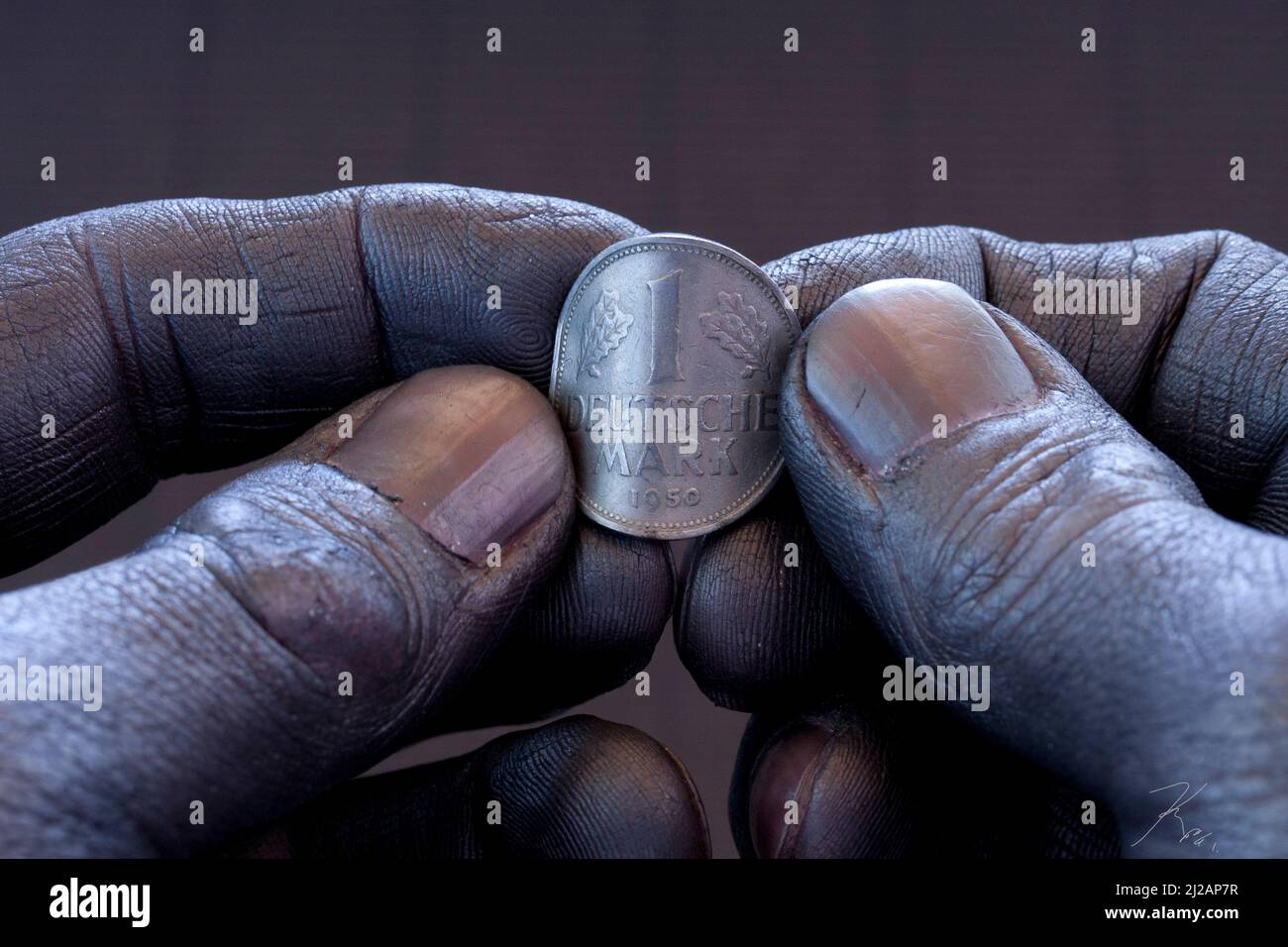 Hände und D-Mark Stockfoto