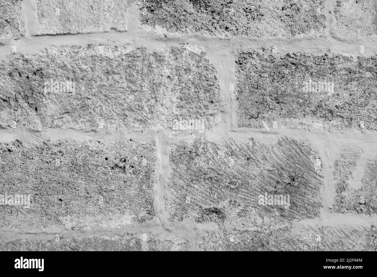 Struktur der Steinwand aus großen Steinen. Steinwall Hintergrund. Ein Träger mit Natursteinen für Branding, Kalender, Postkarte, Tapete, Poster, Banner Stockfoto