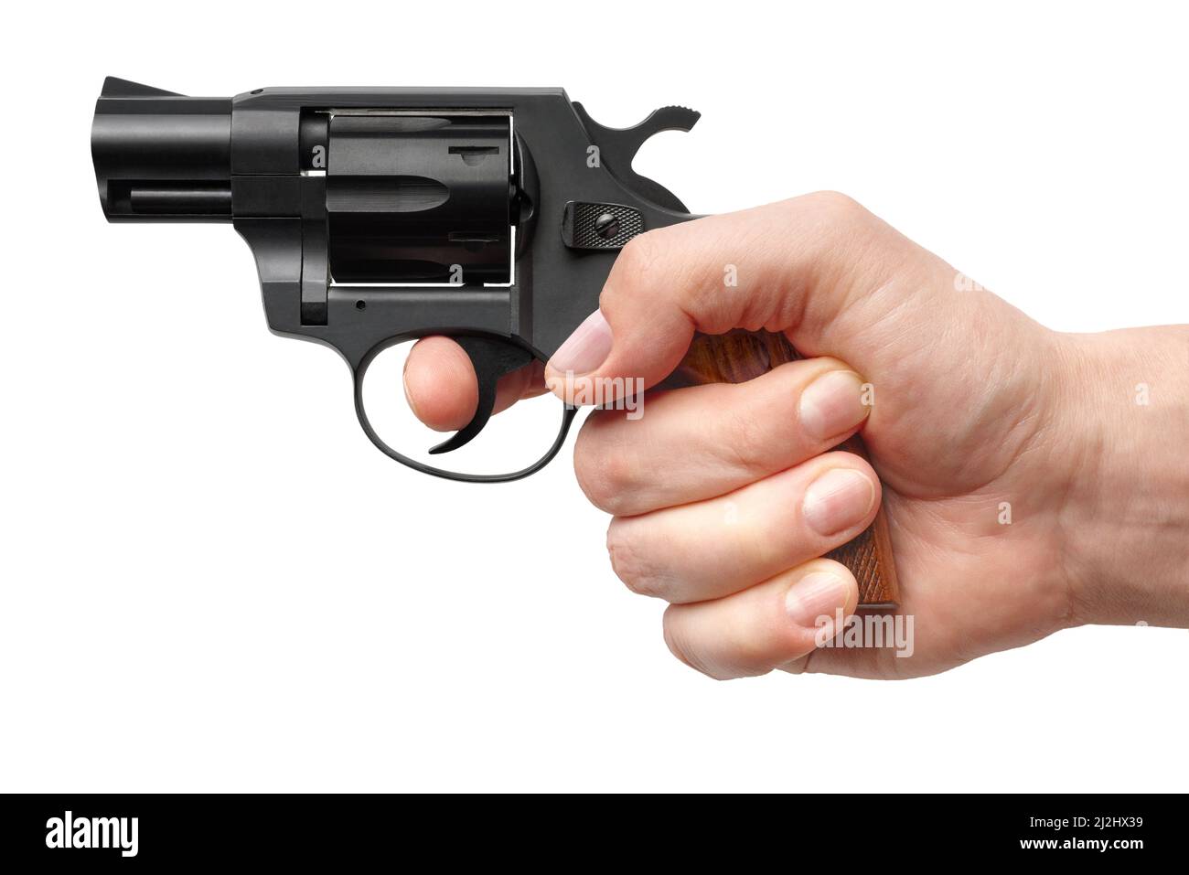Männliche Hand mit kleiner schwarzer Pistole, isoliert auf weißem Hintergrund Stockfoto