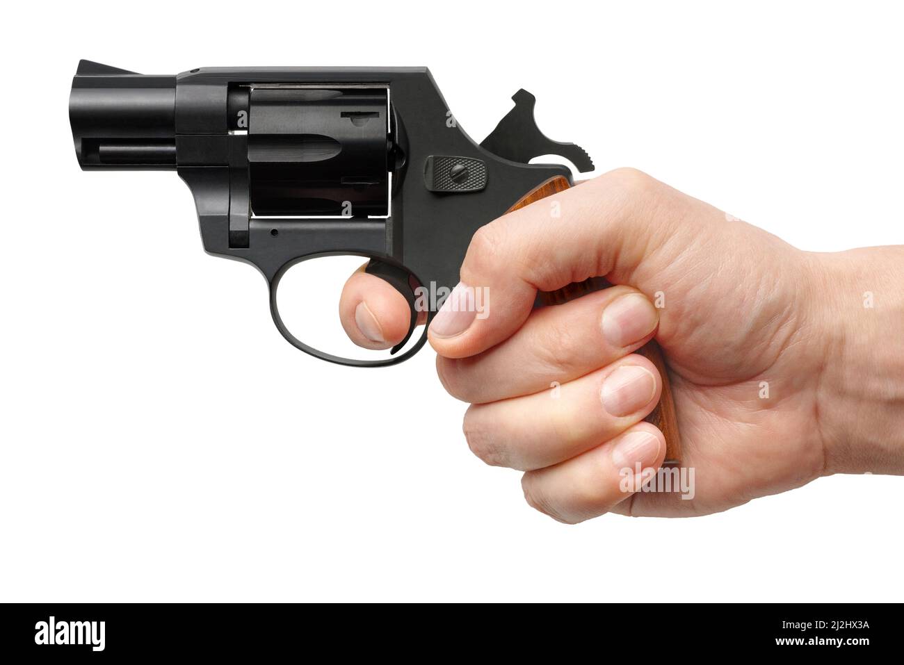 Männliche Hand mit kleiner schwarzer Pistole, isoliert auf weißem Hintergrund Stockfoto