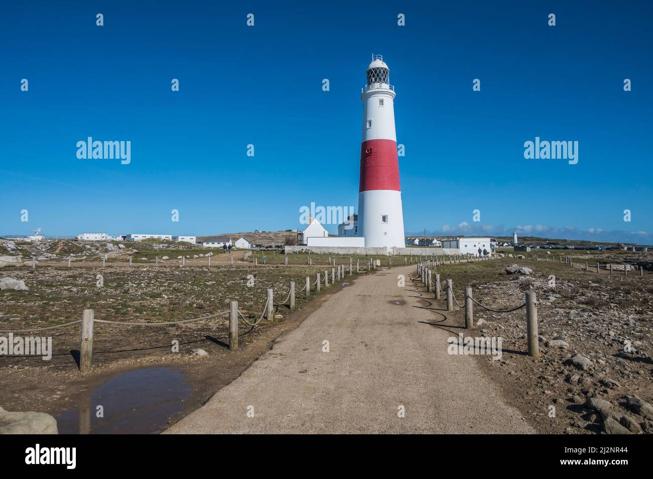 Der Leuchtturm Portland Bill ist 43meters hoch und liegt auf der Isle of Portland in der Nähe des Küstenortes Weymouth im Westen von Dorset, der 1906 zum ersten Mal angezündet wurde Stockfoto