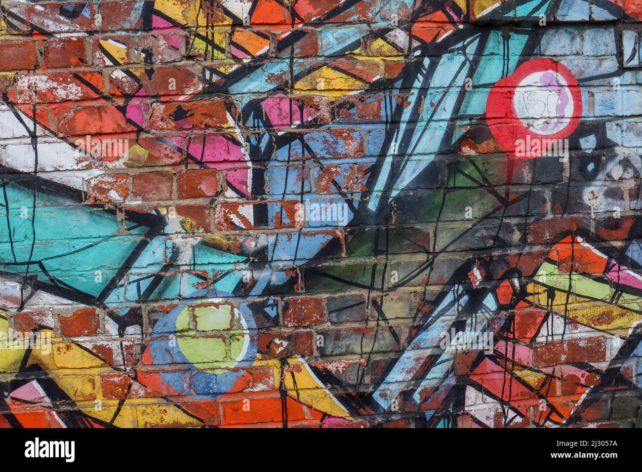 Nahaufnahme von Street Art / Graffiti an einer Backsteinmauer Stockfoto