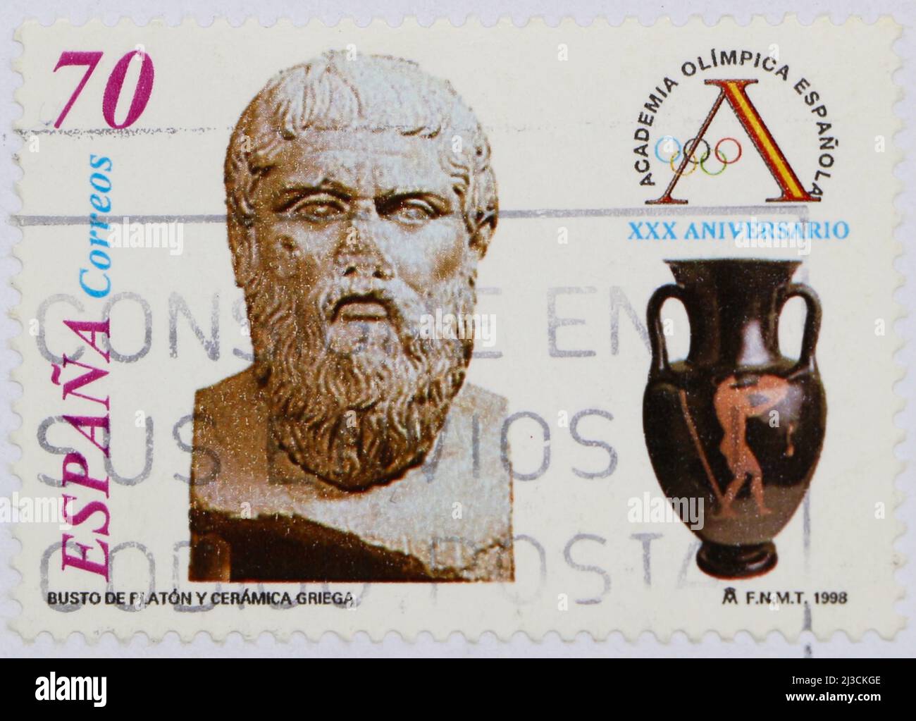 Foto einer gebrauchten spanischen Briefmarke zur Feier des 39.-jährigen Bestehens der Spanischen Olympischen Akademie mit Fotos einer Büste von Plato und einer griechischen Urne Stockfoto