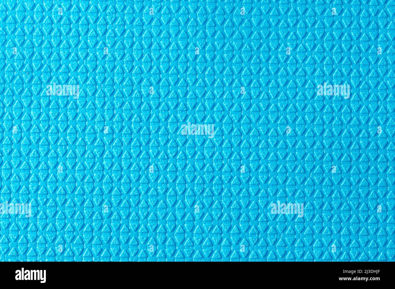 Hintergrund mit grober Textur aus blauen Rautendreiecken. Stockfoto