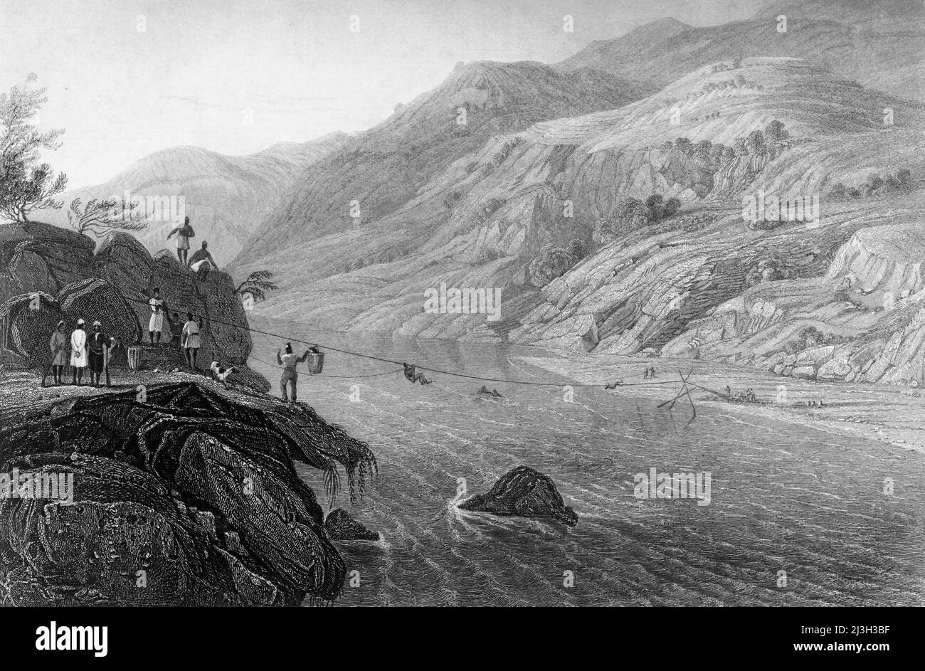 „Crossing the River Tonse“, 1845. Menschen, die in Südindien einen Fluss mit einer Seilbrücke überqueren. Aus "Hindostan, The Shores of the Red Sea, and the Himalaya Mountains, Vol. I". [Fisher, Son &amp; Co., London, 1845] Stockfoto