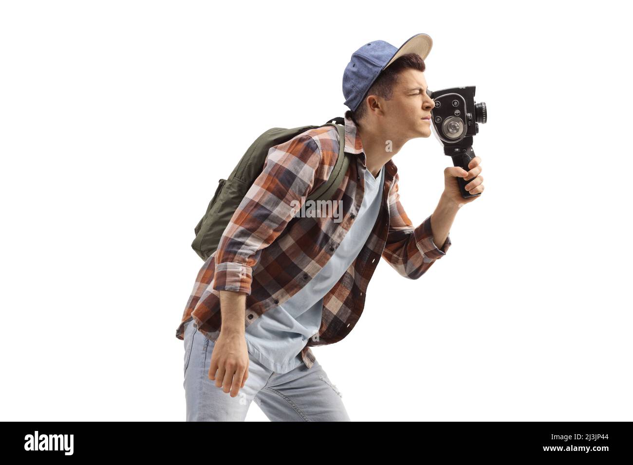 Student mit einer Rucksackaufnahme mit einer Vintage-8-mm-Kamera, isoliert auf weißem Hintergrund Stockfoto