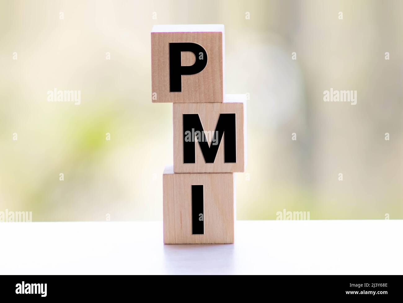 PMI - Akronym von Holzblöcken mit Buchstaben, Abkürzung PMI Private Mortgage Insurance, Purchasing Managers Index concept, random letters around, Stockfoto