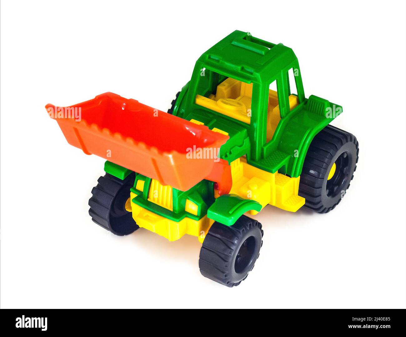 Bunte Kunststoff Spielzeug Radtraktor Lader Bagger, isoliert Stockfoto