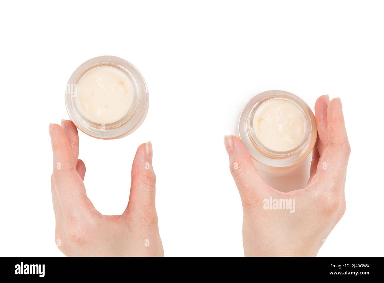 Handcreme isoliert auf weißem Hintergrund. Frauenhände. Stockfoto