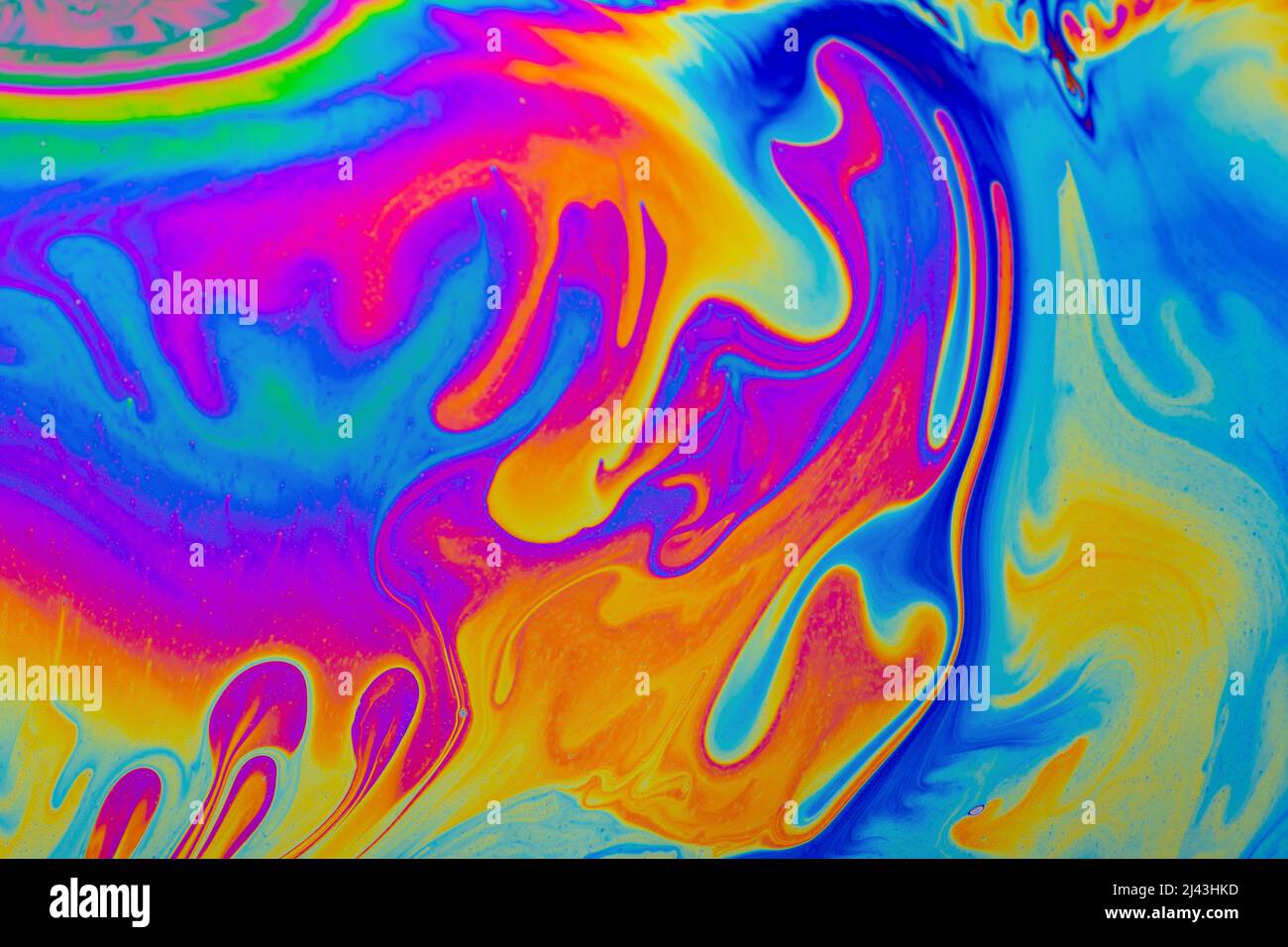 Regenbogenfarben. Psychedelisch mehrfarbige Muster Hintergrund. Foto-Makro-Aufnahme von Seifenblasen Stockfoto