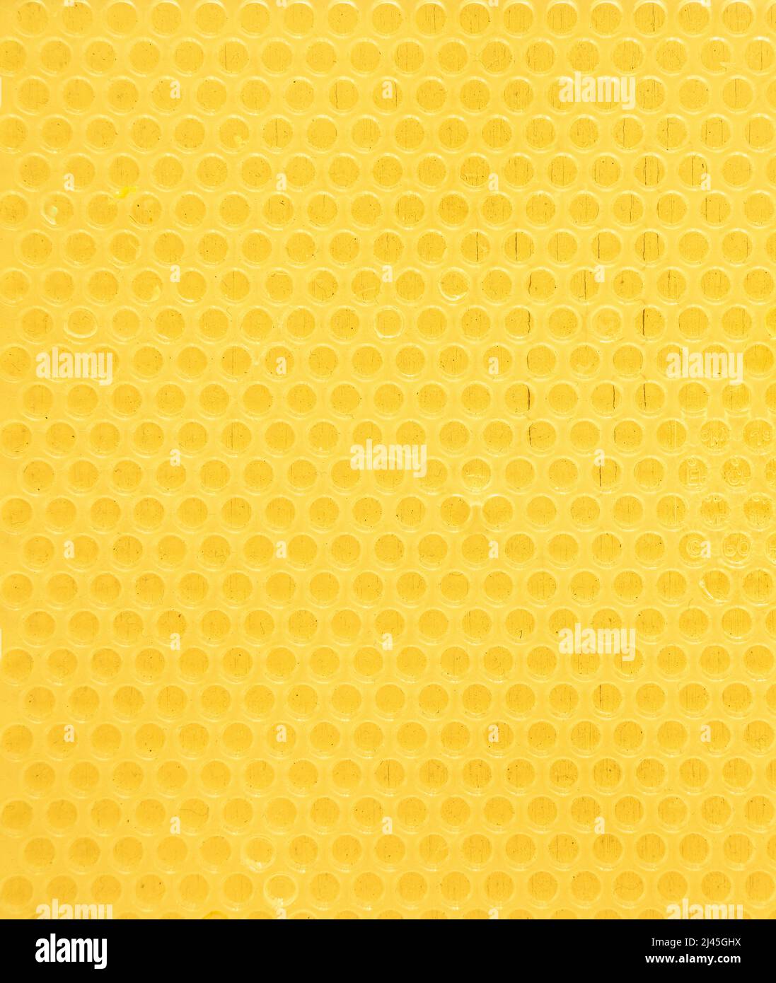 Gelber strukturierter Hintergrund. Sieht aus wie eine Bienenwabe. Hochwertige Fotos Stockfoto