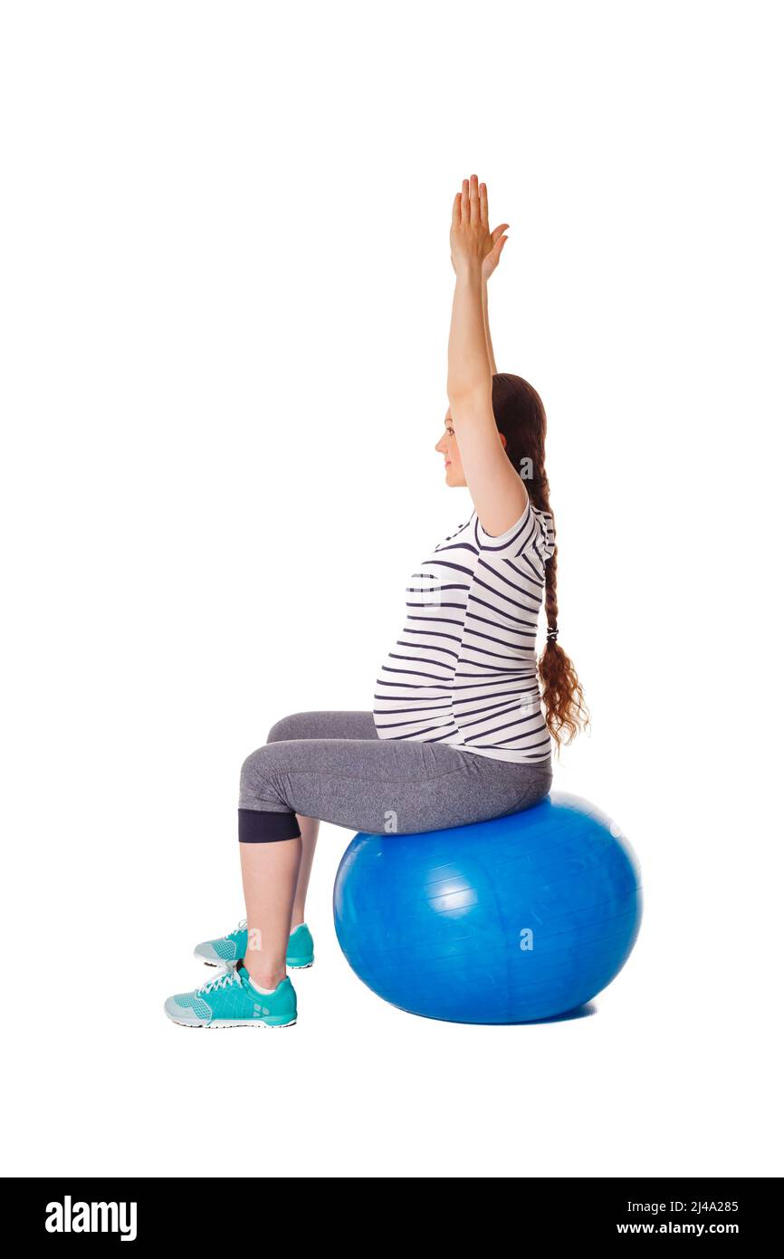Schwanger Frau macht Übungen mit Gymnastikball Stockfoto
