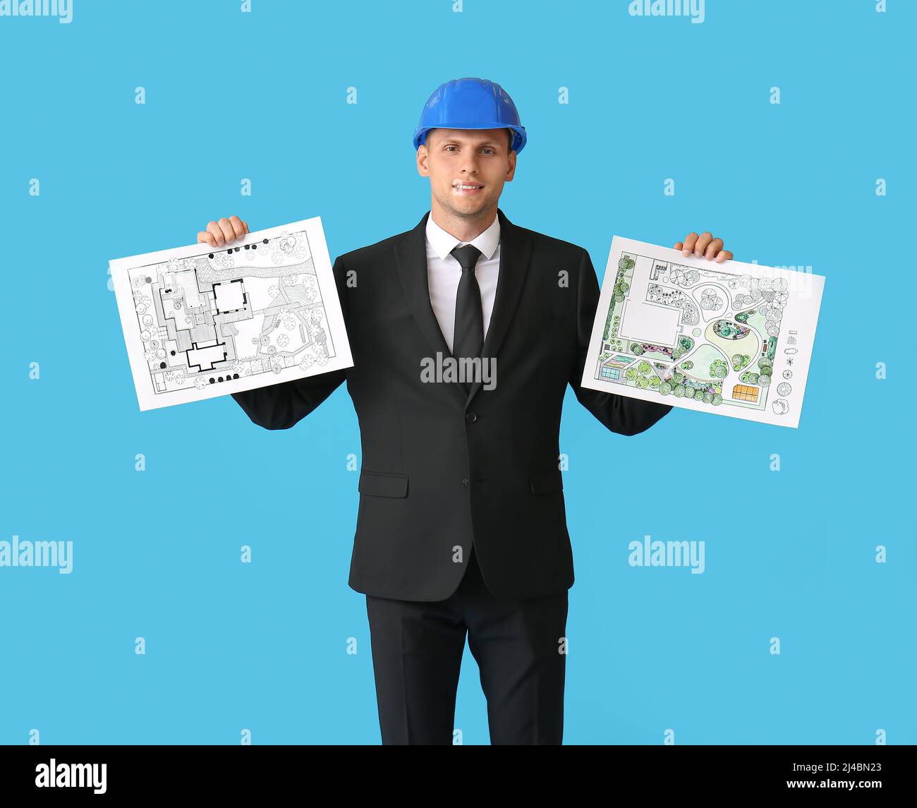 Junger männlicher Landschaftsdesigner mit neuen Projekten auf farbigem Hintergrund Stockfoto