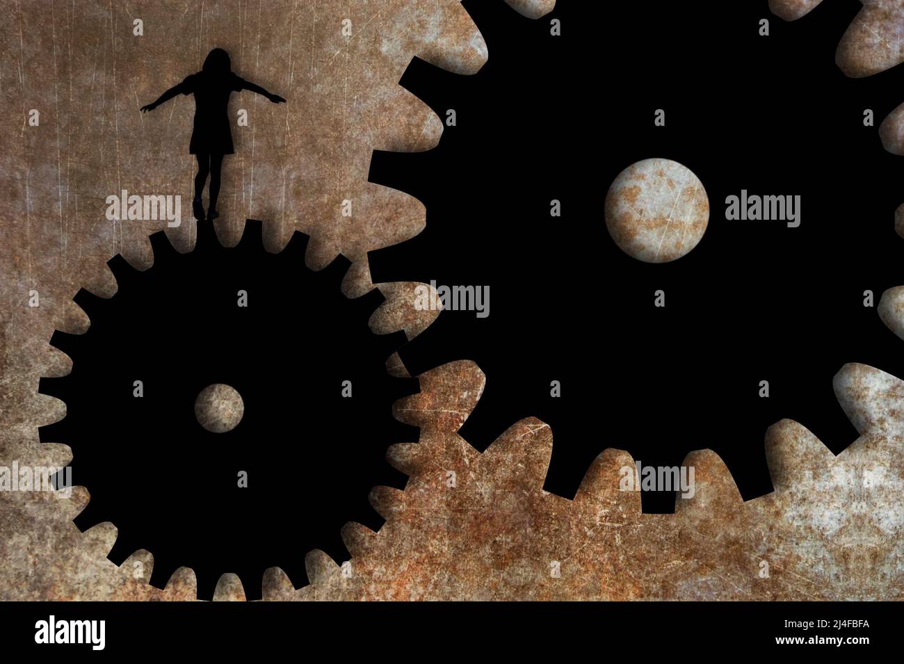 Mädchen balanciert auf einem Zahnradmechanismus Stockfoto
