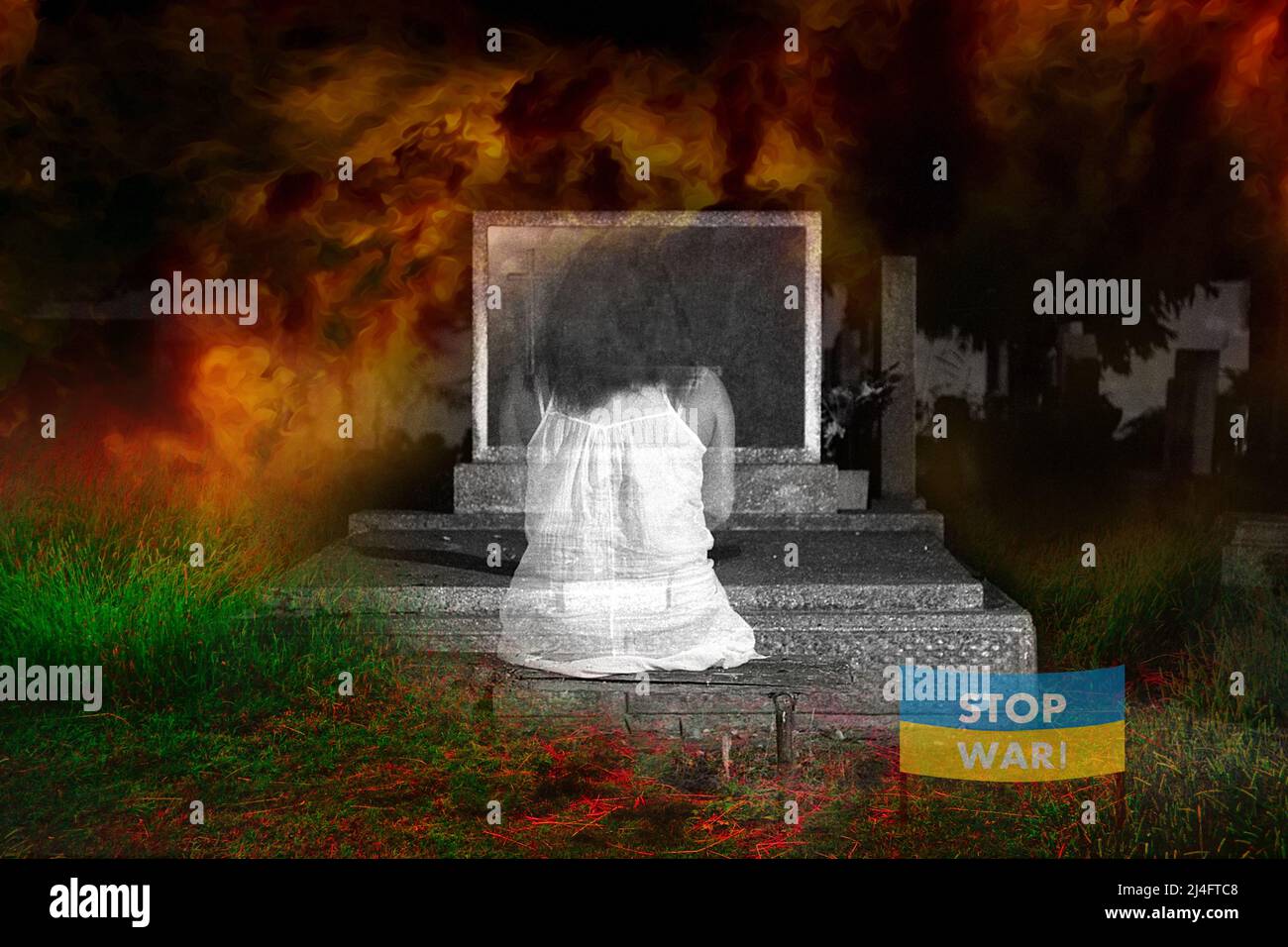 Mädchen am Grab im Feuer des Krieges in der Ukraine, stoppen Sie den Krieg, stoppen Sie den Krieg in der Ukraine Stockfoto